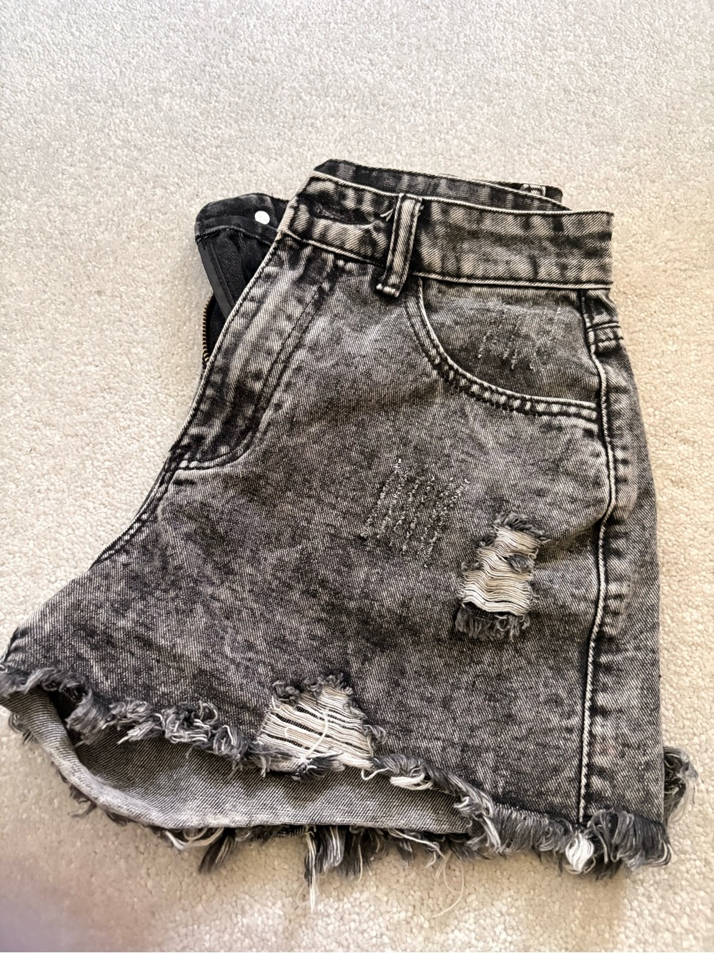 Distressed black jean shorts